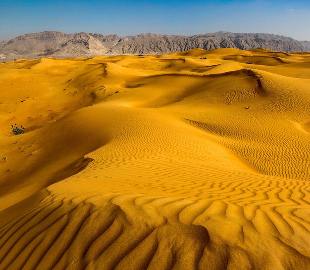 Photo scenic view of desert against sky