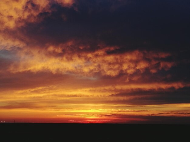 Scenic view of dramatic sky during sunset