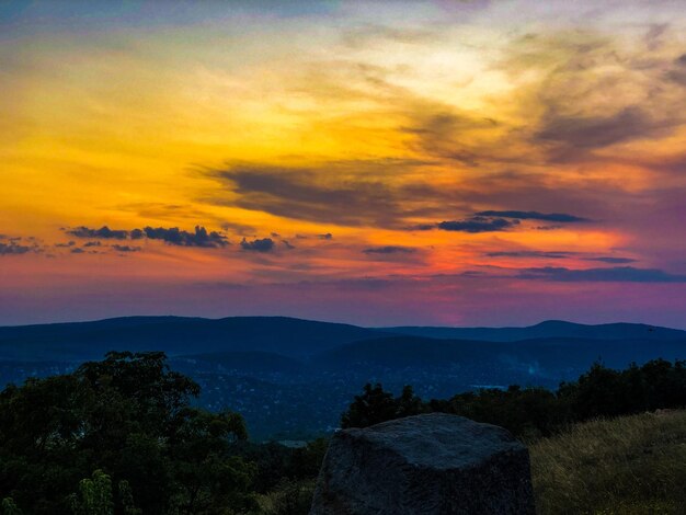 Scenic view of dramatic sky during sunset