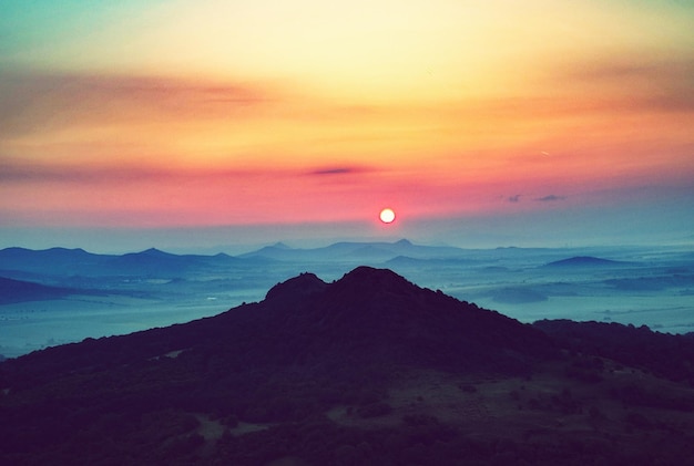 scenic view of dramatic sky over sea during sunset