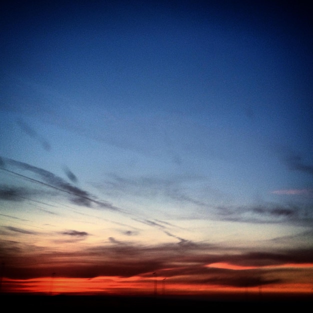 Scenic view of dramatic sky at sunset