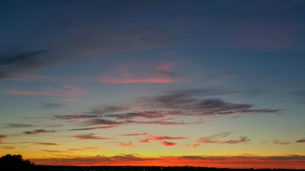 Scenic view of dramatic sky at sunset