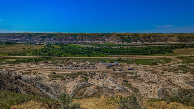 Scenic view of drumheller hoo doos against clear blue sky