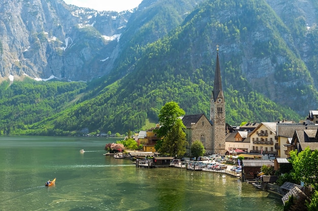 Scenic view of famous Hallstatt mountain village and Evangelical Church with Hallstatter lake