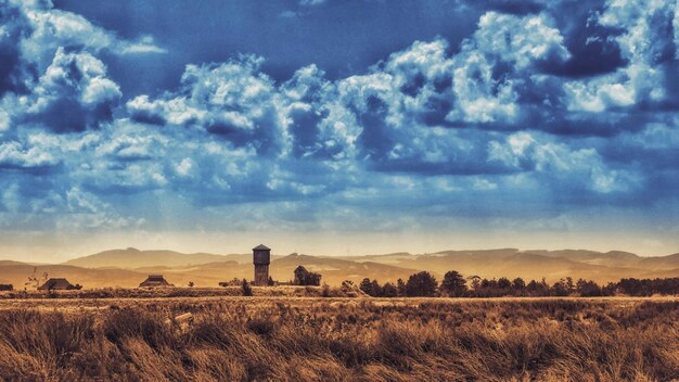 Photo scenic view of farm against sky