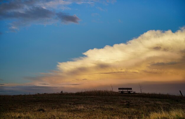 Scenic view of field against sky during sunset