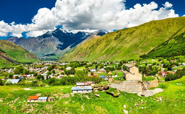 Scenic view of field and mountains against sky