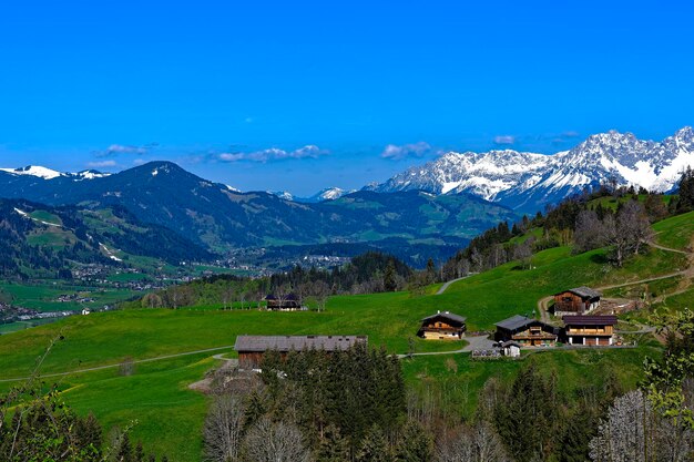 Scenic view of field and mountains against sky