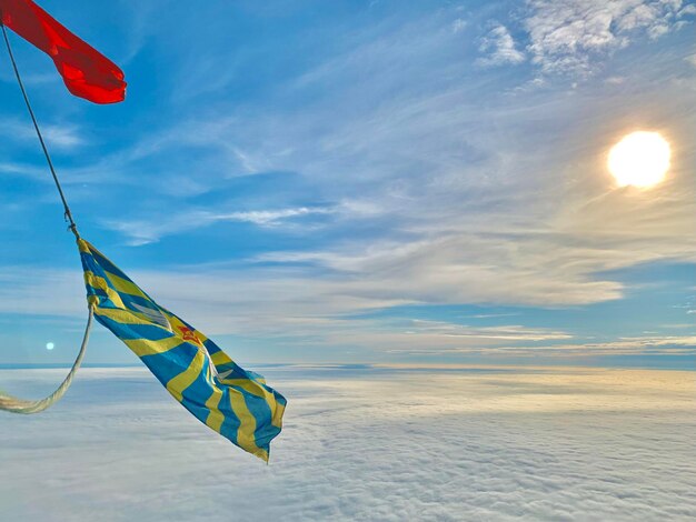 Scenic view of flag against sky during sunset