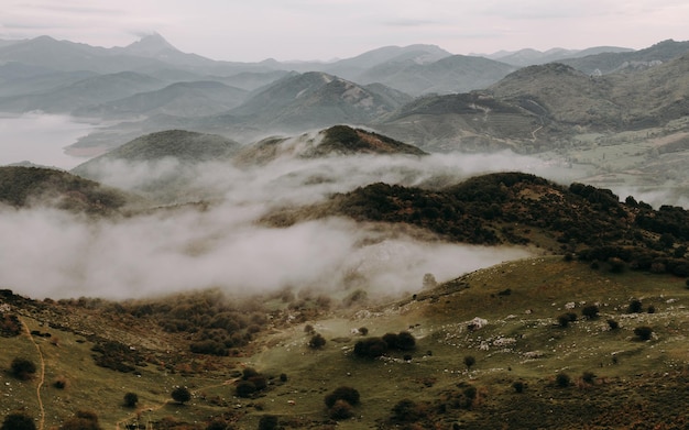 scenic view of foggy mountains against sky