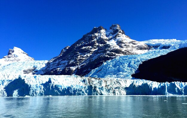 Scenic view of frozen lake against mountain range