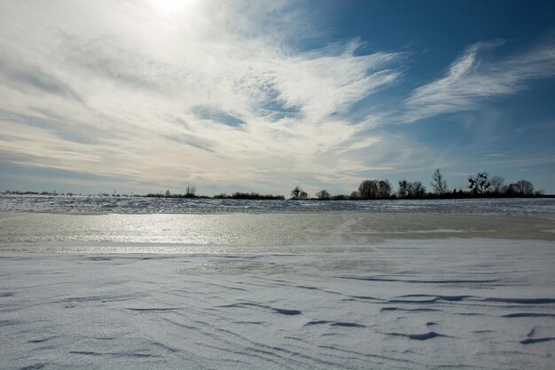 Scenic view of frozen sea against sky during winter