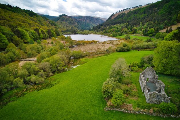 Scenic view of green landscape against sky