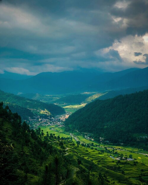 Scenic view of green valley landscape against beautiful sky