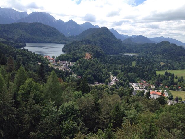 Scenic view of houses and mountains against sky