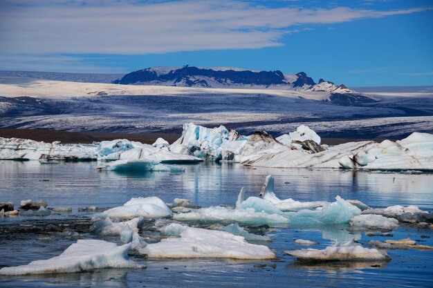 Scenic view of icebergs and mountains on jokulsarlon glacial lagoon