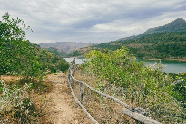 Scenic view of kiriandich dam against a cloudy day in baringo county kenya