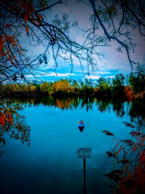 Scenic view of lake against blue sky