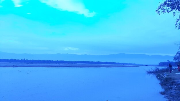 Scenic view of lake against blue sky