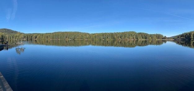 Photo scenic view of lake against blue sky