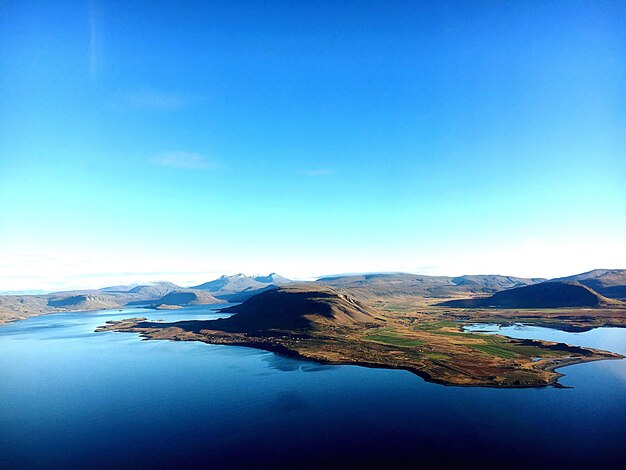 Scenic view of lake against blue sky