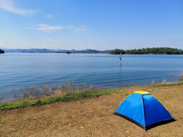 Scenic view of lake against blue sky