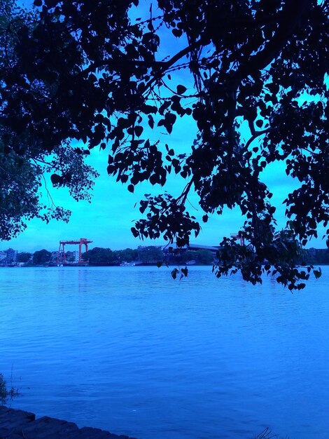 Scenic view of lake against blue sky