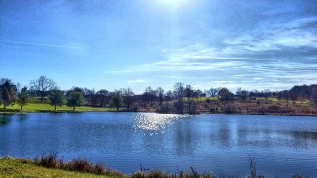 Scenic view of lake against blue sky