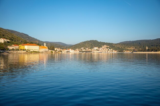 Scenic view of lake against clear blue sky