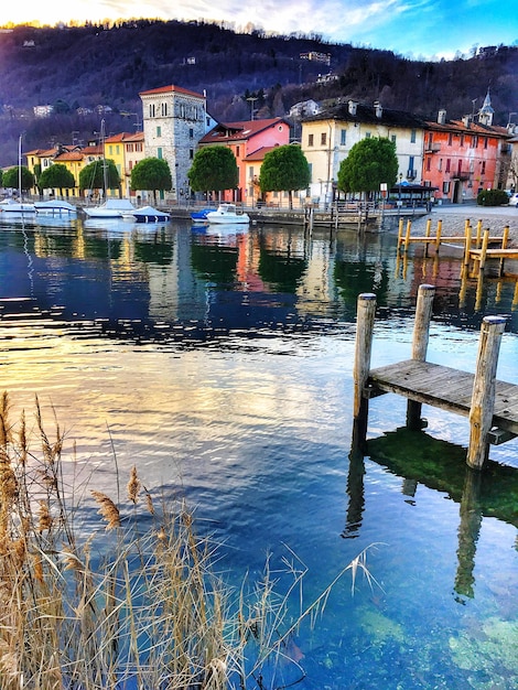 Scenic view of lake against houses in town