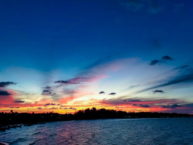 Scenic view of lake against romantic sky at sunset