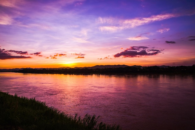 Scenic view of lake against romantic sky at sunset