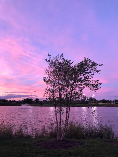 Scenic view of lake against romantic sky at sunset