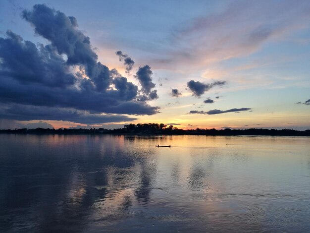 Scenic view of lake against sky during sunset