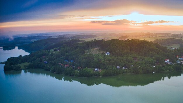 Scenic view of lake against sky during sunset