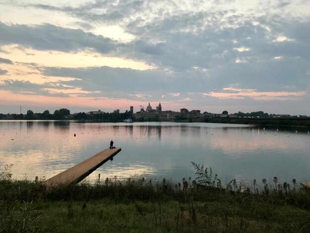 Scenic view of lake against sky during sunset