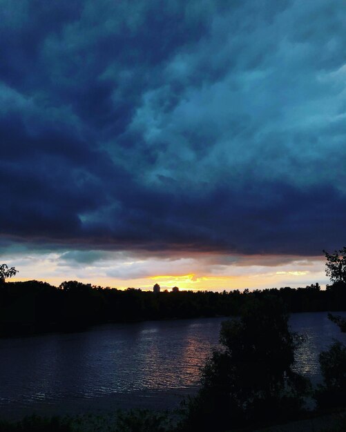 Scenic view of lake against sky during sunset