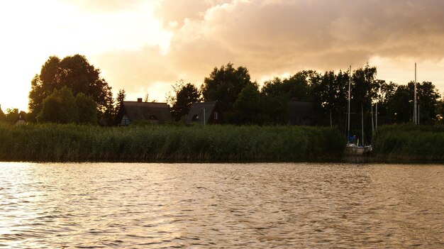 Scenic view of lake against sky during sunset