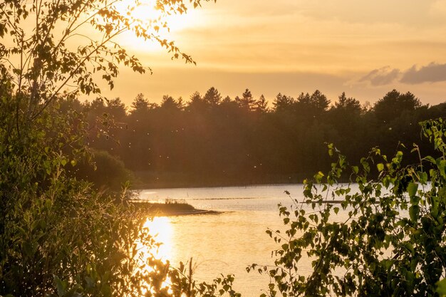 Scenic view of lake against sky during sunset