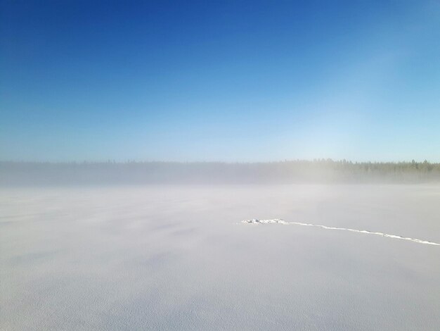 Scenic view of lake against sky during winter