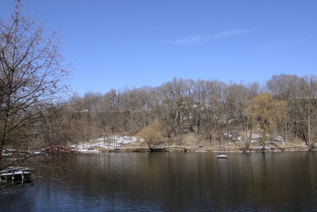 Scenic view of lake against sky during winter