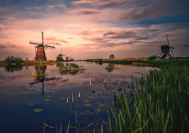 Photo scenic view of lake against sky at sunset