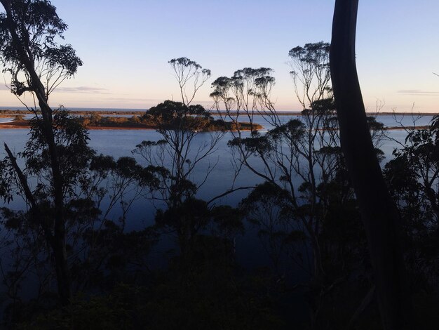 Scenic view of lake against sky at sunset