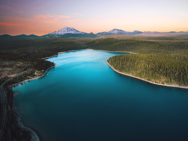 Scenic view of lake against sky at sunset