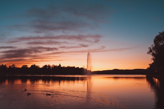 Scenic view of lake against sky during sunset