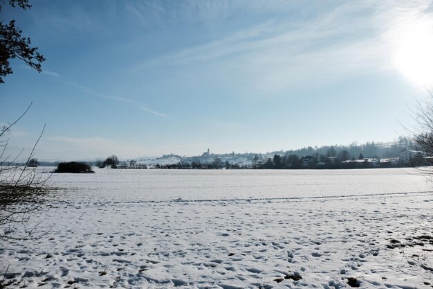 Scenic view of lake against sky during winter