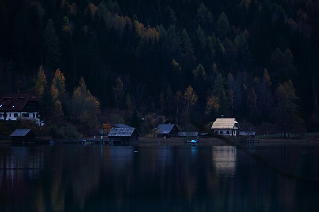 Scenic view of lake by house