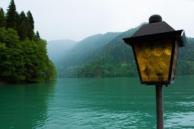 Scenic view of lake by mountains against sky