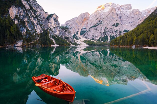 Scenic view of lake by mountains against sky