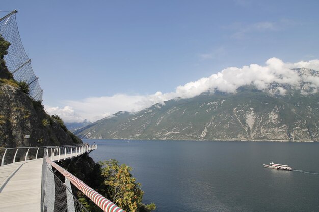 Scenic view of lake by mountains against sky